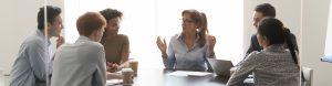 Woman leading strategy meeting in conference room
