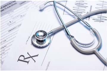 card image of a stethoscope over a prescription paperwork