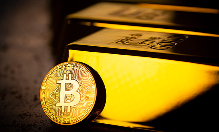 Gold bars and Bitcoin cryptocurrency financial concept
